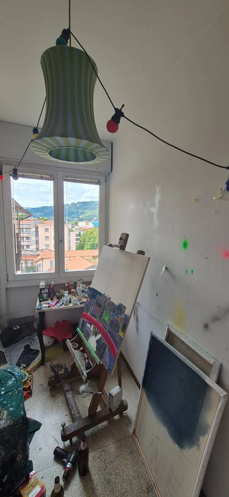 Federico Carminati’s studio, with easel and canvases in progress